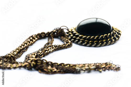 Gold necklace on white background