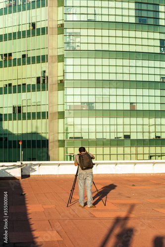 Photographer on his back on rooftop