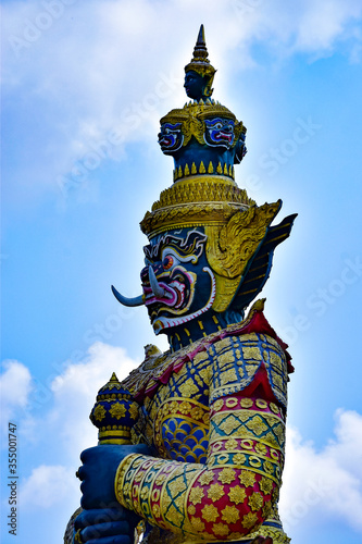 Giant guardian statue in Bangkok Thailand on blue sky background