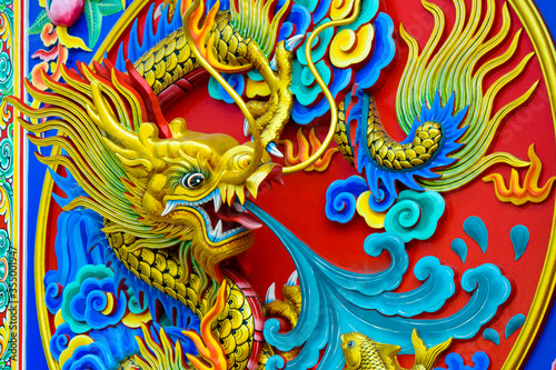 The close up of the dragon's fight on the red wall.
