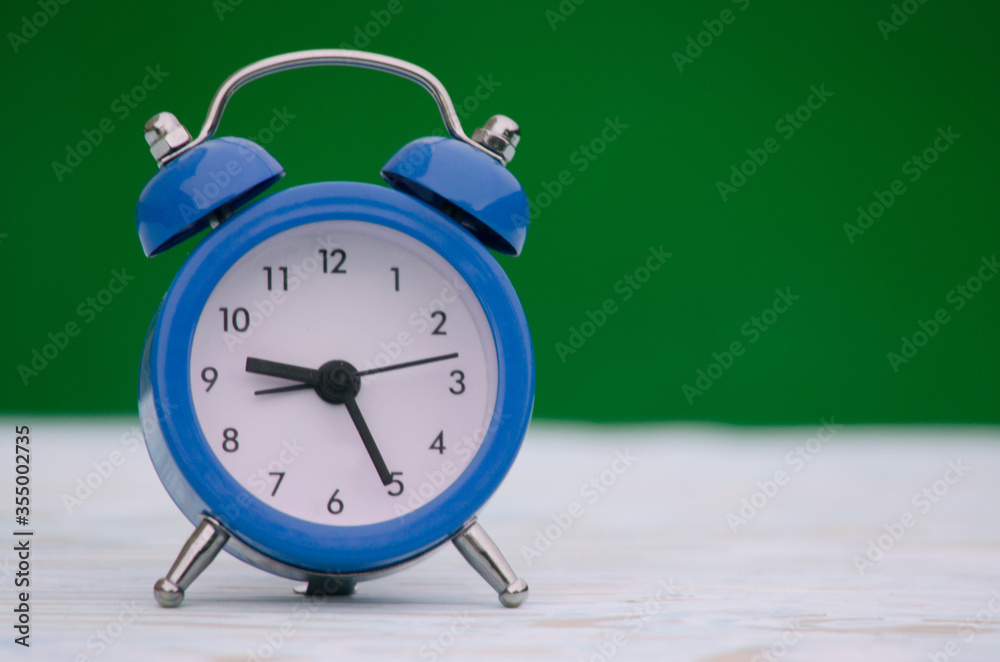 A small alarm clock gives a signal