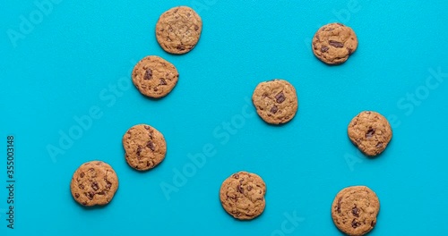 Chocolate chip cookies animation. Cookies moving on blue background
