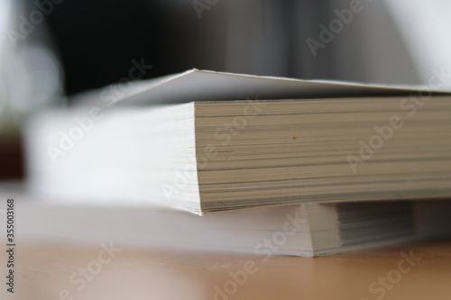 Books, Thick heavy books with white paper and hard cover, good binding, perfect binding, large number of pages, huge page booklet on table