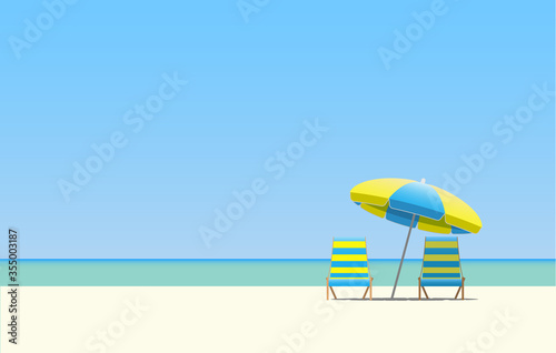 Two sun beds under a beach umbrella.