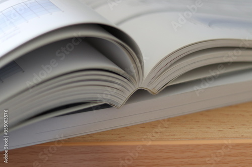 Books, Thick heavy books with white paper and hard cover, good binding, perfect binding, large number of pages, huge page booklet on table