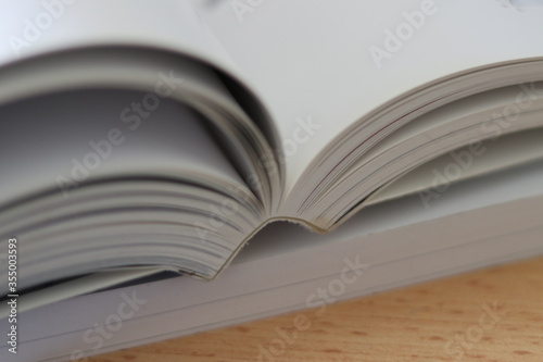 Books, Thick heavy books with white paper and hard cover, good binding, perfect binding, large number of pages, huge page booklet on table
