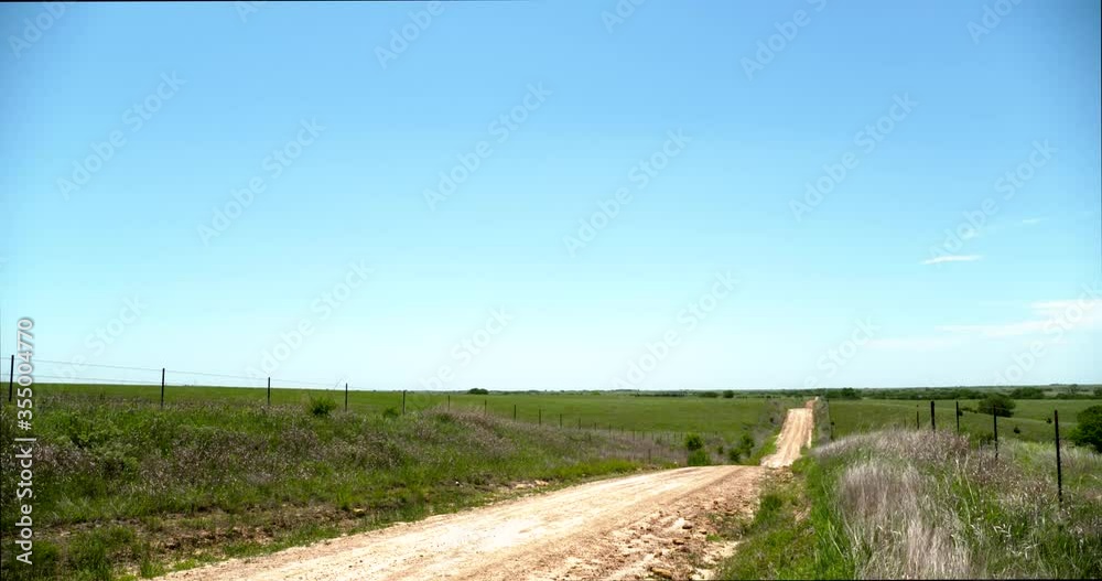 country dirt road to horizon ranch on the prairie countryside country dirt road to horizon ranch on the prairie countryside