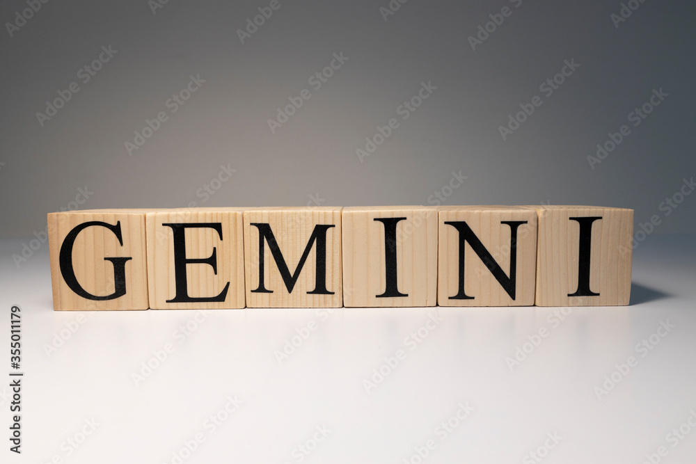 Gemini word on wooden cubes on white background. Gemini word on wooden cubes on white background.