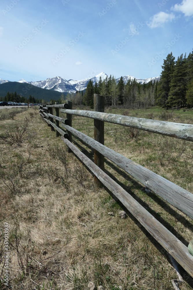 Wooden fence in valley between Kananaskis mountains in the Canadian Rockies