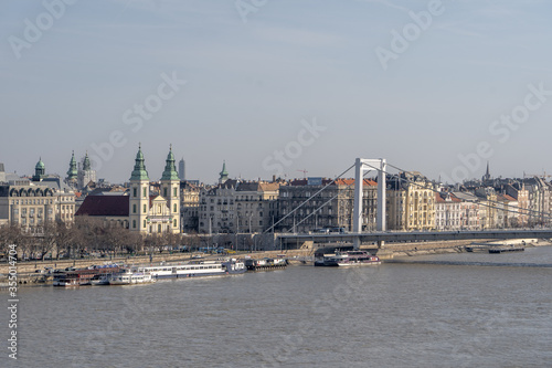 Elisabeth bridge and Parish church by danube river in Budapest in winter morning