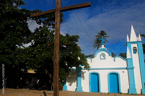 Historic church of Praia do Forte, Bahia, Brazil. Chapel of Saint Francis, old colonial architecture, at the main square. Famous summer northeast brazilian beach town and tourist travel destination photo