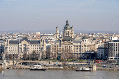 Gresham Palace with St. Stephen's Basilica on Danube riverside in Budapest winter morning