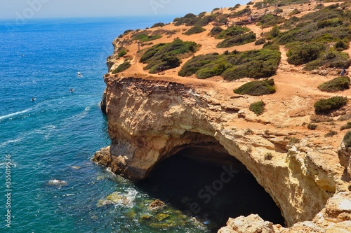 Benagil Cave Top View With Turquoise Atlantic Ocean. Spectacular View at Benagil Grotto from Above in Carvoeiro.