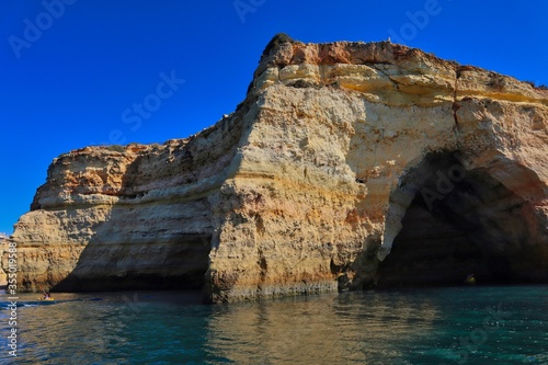 Benagil cave from the sea side. Beautiful natural sea cave with blue sky and atlantic ocean in Carvoeiro.