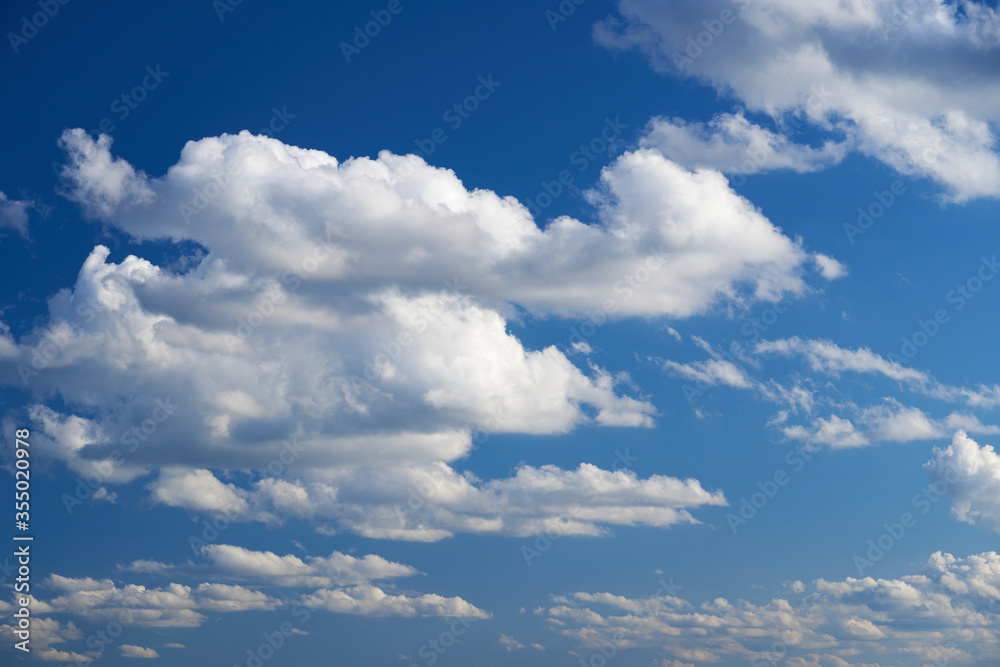 Bright beautiful blue sky with soft clouds, bright sunny day Bright beautiful blue sky with soft clouds, bright sunny day