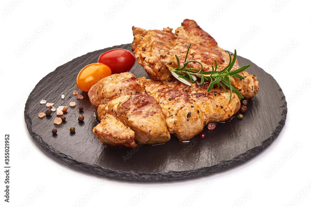 Grilled juicy pork steak, BBQ dishes, isolated on white background Grilled juicy pork steak, BBQ dishes, isolated on white background
