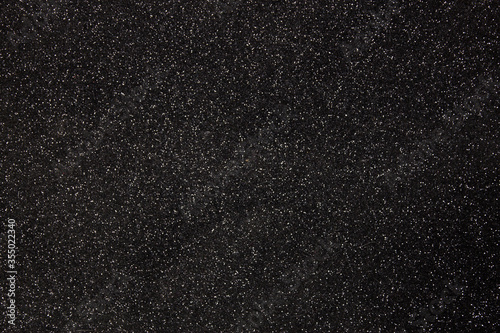 Textura negra con puntos brillantes brillantina para fondo photo