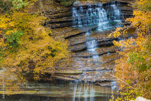 Fall Foliage Over Waterfall in Clifty Creek Park, Southern Indiana photo