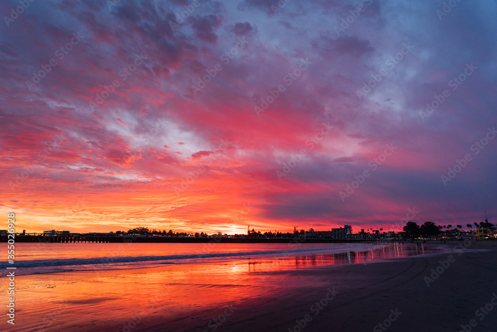 Incredible red sunset in Santa Cruz. Red sky on the beach in California
