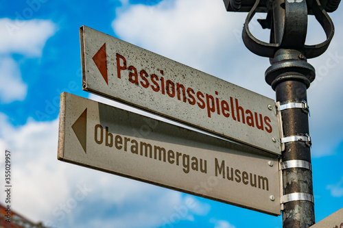 Direction sign to Passion Play Theater and Museum in Oberammergau Germany. High quality photo photo