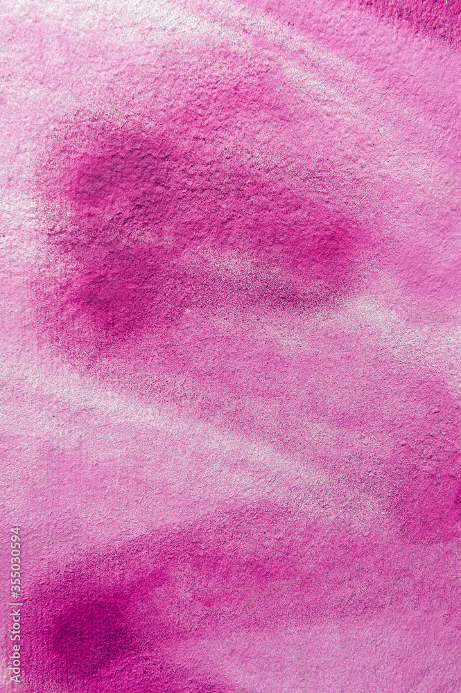 pink background: the white wall is unevenly painted with pink paint sprayed with an aerosol can