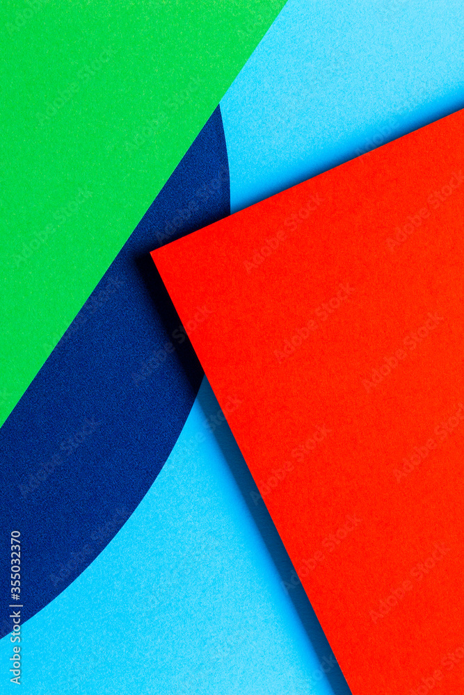 Abstract colored paper texture background. Minimal geometric shapes and lines in red, light blue, navy, green colors Abstract colored paper texture background. Minimal geometric shapes and lines in red, light blue, navy, green colors