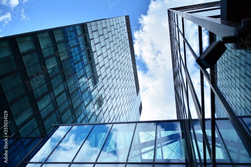 Facade texture of a glass mirrored office building. Fragment of the facade. Modern architecture of the office building.