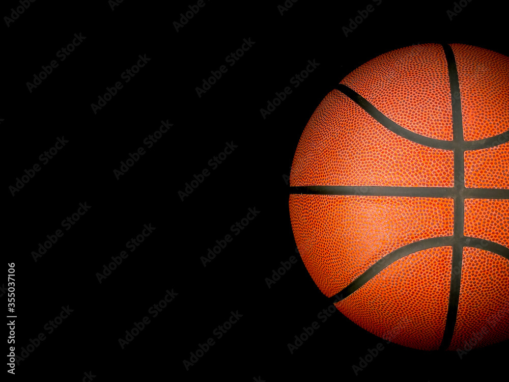 Fototapeta Basketball ball over black background