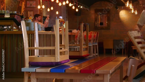 The Waiter prepares the Restaurant for Reopening after Quarantine