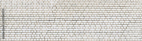 Contemporary weathered white brick wall. Abstract brick texture background panorama.