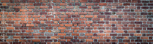 Brown and Red brick wall. Texture of old weathered brick wall panoramic backgorund.