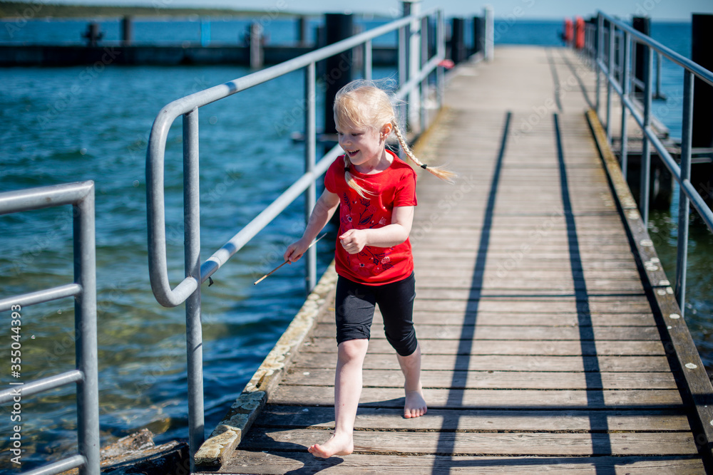 Girl walking on bridge. Reuniting with nature. Childhood, lifestyle.
Girl walking on bridge. Reuniting with nature. Childhood, lifestyle.