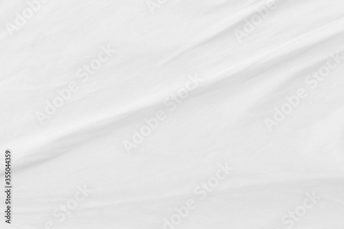 White cloth background abstract with soft waves.