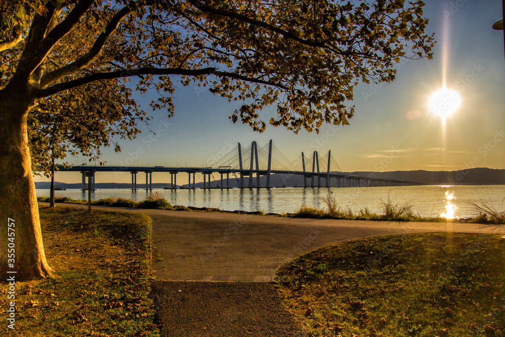 Tarrytown, NY / United States - Sept. 19, 2019: a landscape image of Pierson Park at sunset over the Hudson River.