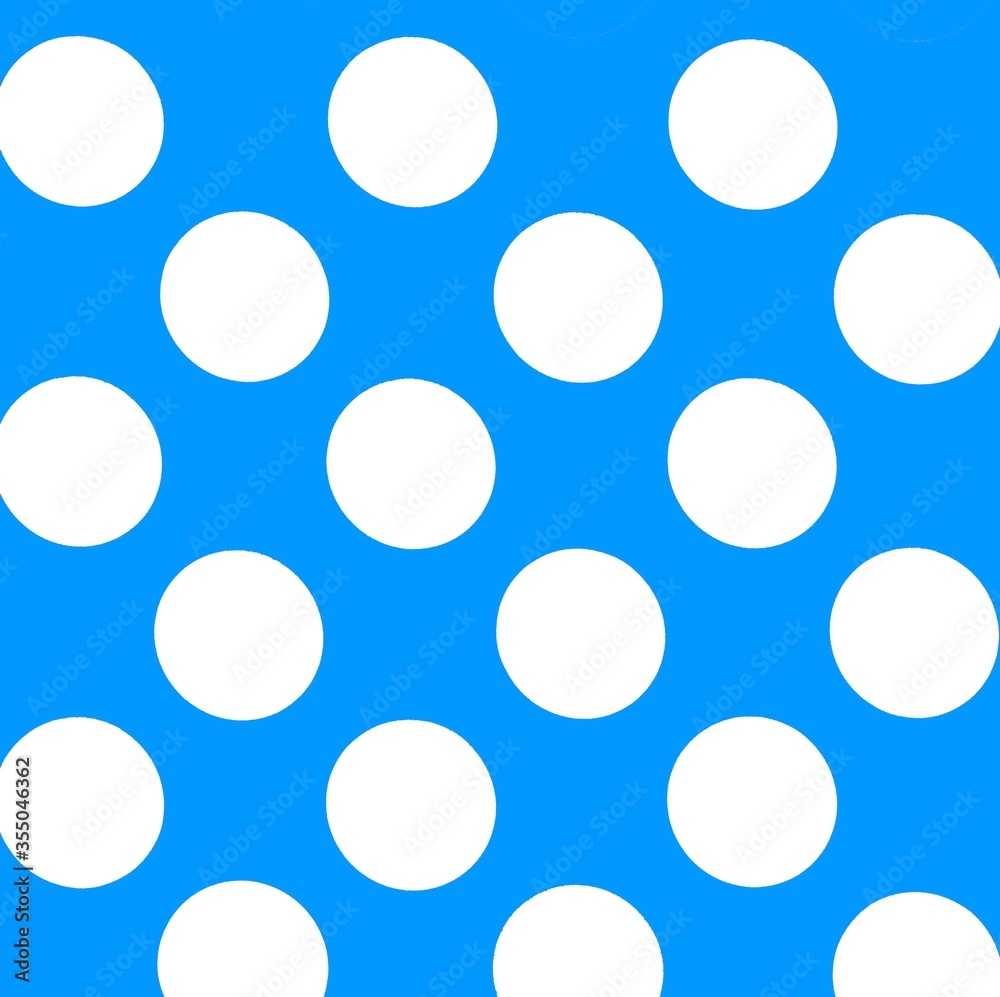White polka dots in front of blue background
