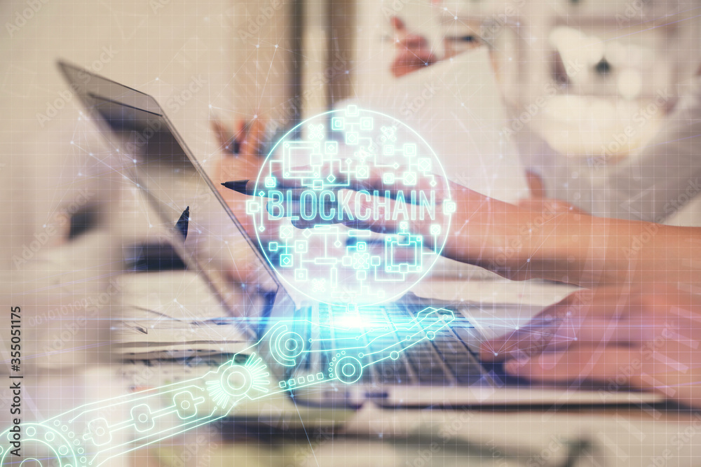 Double exposure of woman hands typing on computer and crypto market theme hologram drawing. Blockchain concept. Double exposure of woman hands typing on computer and crypto market theme hologram drawing. Blockchain concept.