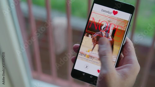 Left swipe big nope to women on smartphone dating app 4K photo