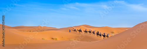 Merzouga in the Sahara Desert in Morocco. Web banner in panoramic view. © marabelo