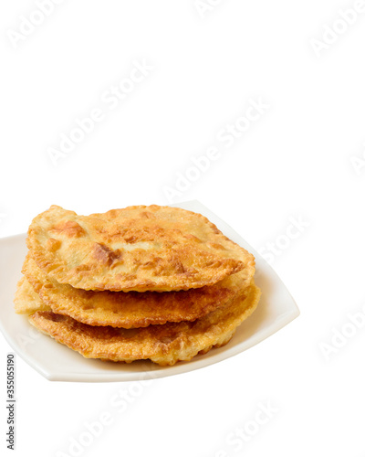 Cheburek - fried pie with meat and onions isolated on a white background. Asian cuisine.