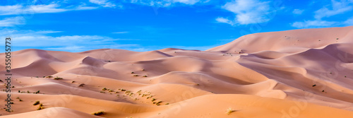 Merzouga in the Sahara Desert in Morocco. Web banner in panoramic view.