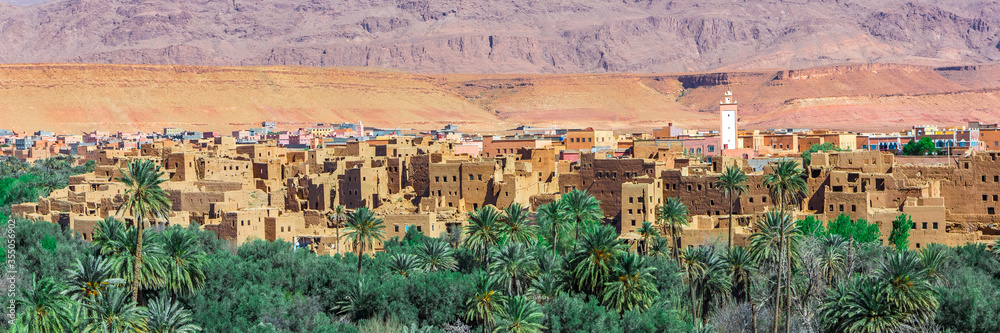 Ait Benhaddou Kasbah, Ait Ben Haddou, Ouarzazate, Morocco. Web banner in panoramic view. Ait Benhaddou Kasbah, Ait Ben Haddou, Ouarzazate, Morocco. Web banner in panoramic view.