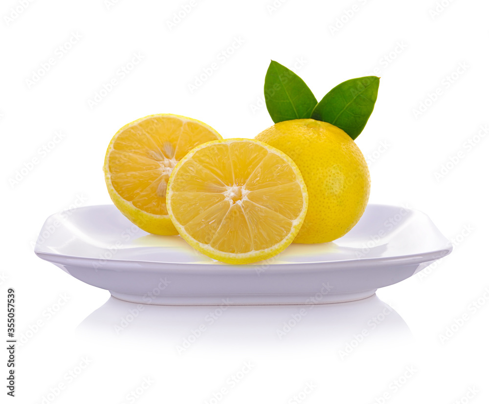 Lemons  on plate isolated on white background.