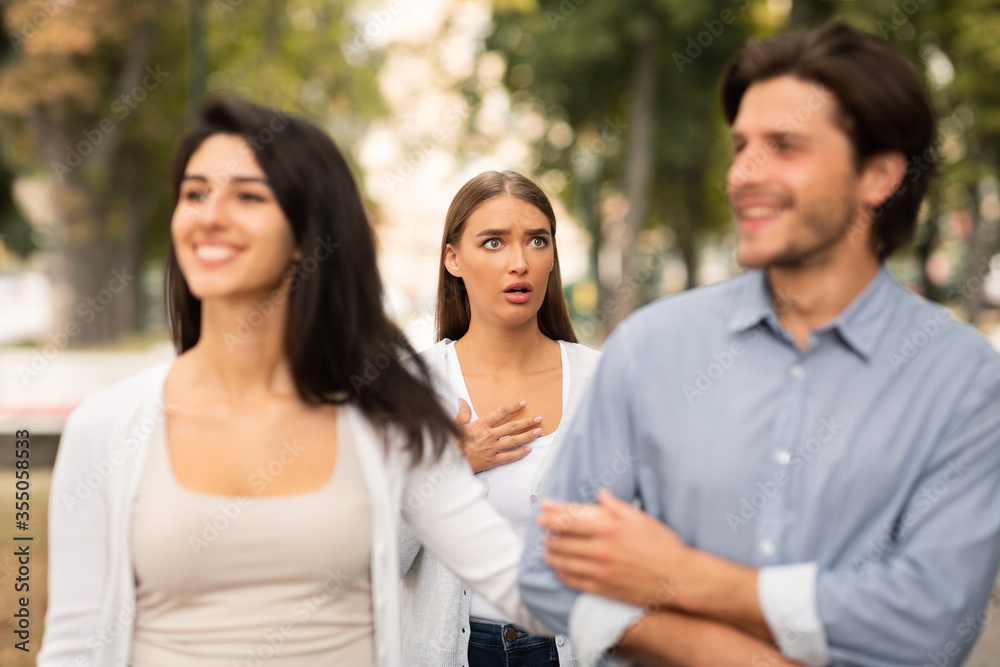 Woman Seeing Cheating Boyfriend Dating With Other Girl In Park Woman Seeing Cheating Boyfriend Dating With Other Girl In Park
