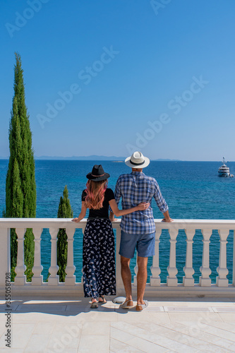 Young couple enjoying the view from a luxury villa in Croatia, Europe 