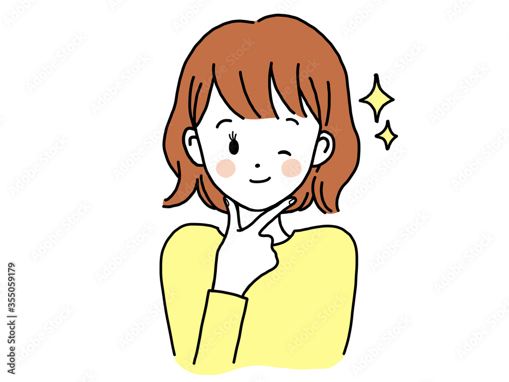 顔に手を当ててウィンクしながら自慢顔をする女性 顔に手を当ててウィンクしながら自慢顔をする女性