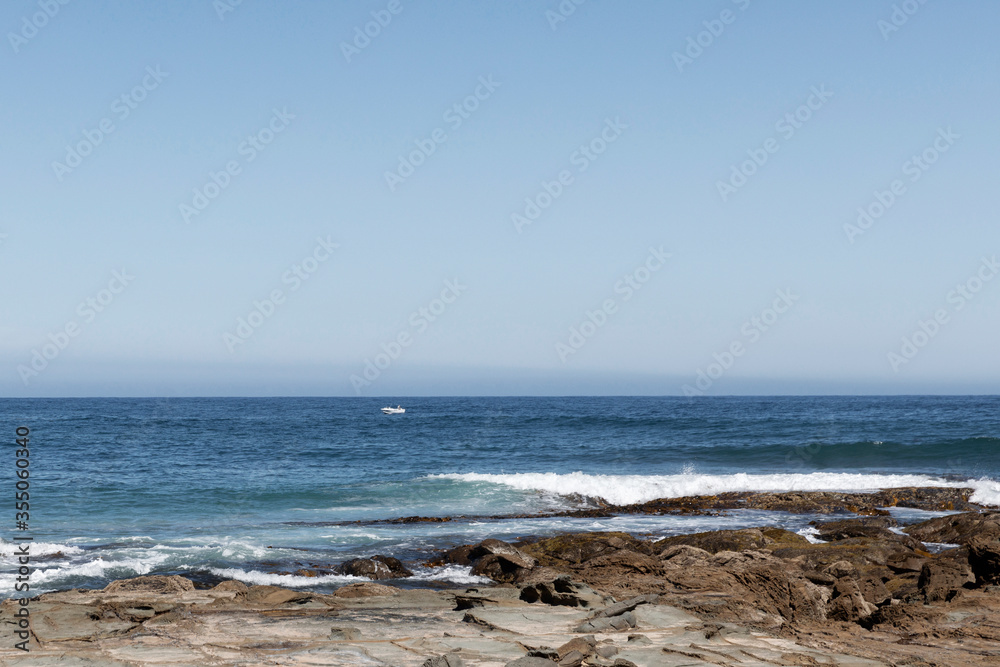 Isolated fishing boat in open water off the Australian coastline. Isolated fishing boat in open water off the Australian coastline.