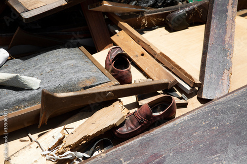 Abandoned pair of shoes & various debris left behind.