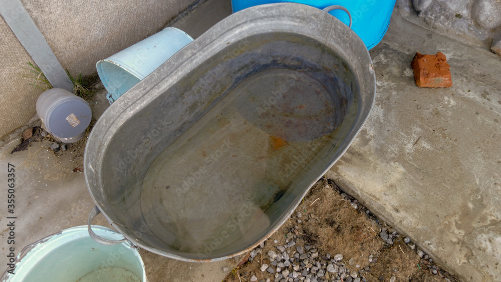 a container filled with rain water a container filled with rain water