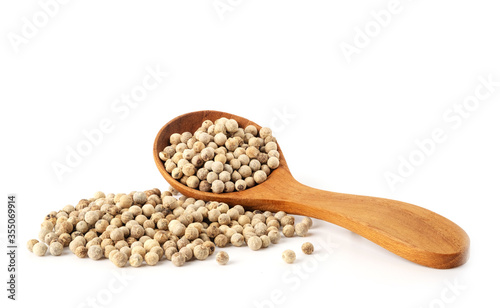 Peppercorns in wooden spoon isolated on white background