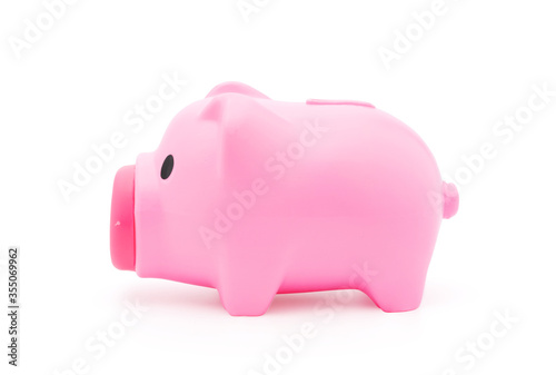 Side view of Pink pig piggy toy plastic or for use money coin saving concept isolated on white background with clipping path